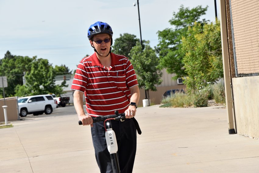 Mayor Greg Mills is taking a ride on the new Bird Scooter.